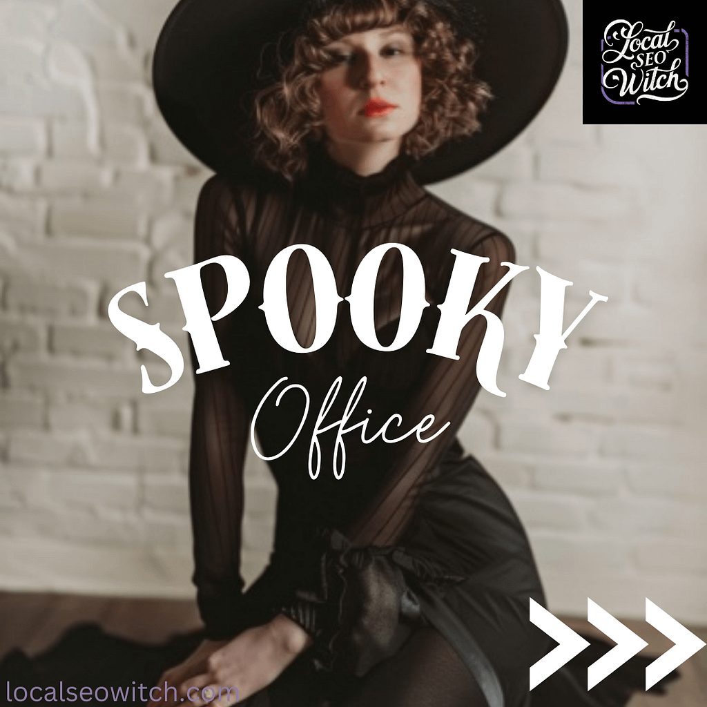 Spooky brand photoshoot of a woman with brown hair and a wide brim hat kneeling against a white brick wall